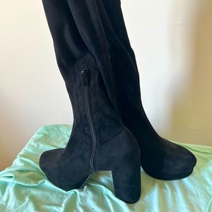 Thigh high black boots